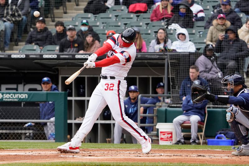 Apr 30, 2023; Chicago, Illinois, USA; Chicago White Sox left fielder Gavin Sheets (32) hits a one run sacrifice fly ball against the Tampa Bay Rays during the first inning at Guaranteed Rate Field. Mandatory Credit: David Banks-USA TODAY Sports