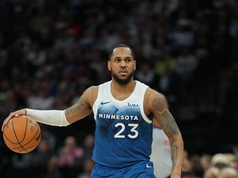 MINNEAPOLIS, MN -  MARCH 22: Monte Morris #23 of the Minnesota Timberwolves handles the ball during the game against the Cleveland Cavaliers on March 22, 2024 at Target Center in Minneapolis, Minnesota. NOTE TO USER: User expressly acknowledges and agrees that, by downloading and or using this Photograph, user is consenting to the terms and conditions of the Getty Images License Agreement. Mandatory Copyright Notice: Copyright 2024 NBAE (Photo by Jordan Johnson/NBAE via Getty Images)