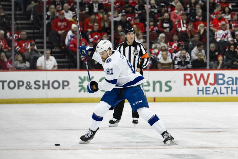 Feb 25, 2024; Newark, New Jersey, USA; Tampa Bay Lightning defenseman Erik Cernak (81) passes the puck against the New Jersey Devils during the first period at Prudential Center. Mandatory Credit: John Jones-USA TODAY Sports