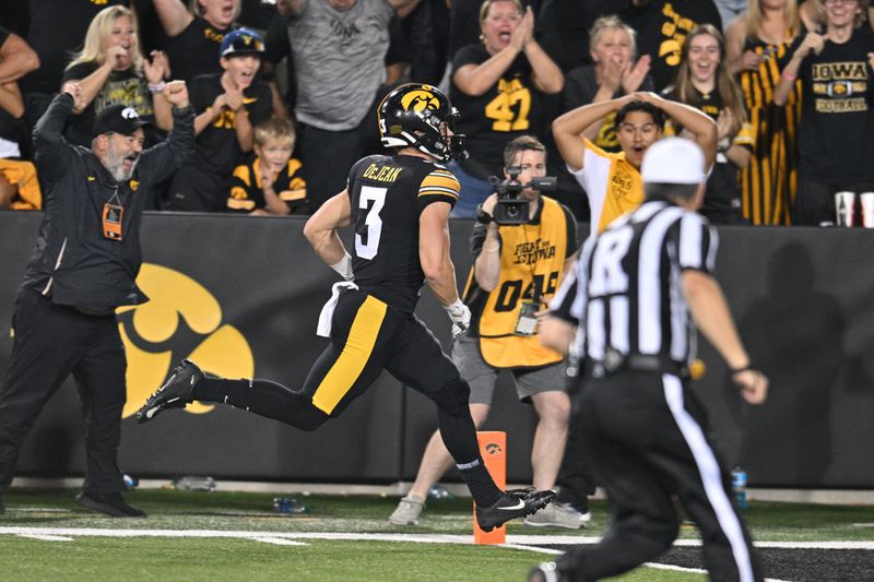 Sep 30, 2023; Iowa City, Iowa, USA; Iowa Hawkeyes defensive back Cooper DeJean (3) scores a touchdown on a punt return against the Michigan State Spartans during the fourth quarter at Kinnick Stadium. Mandatory Credit: Jeffrey Becker-USA TODAY Sports