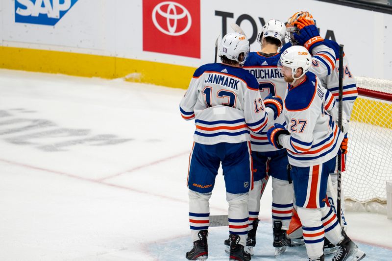 Dec 28, 2023; San Jose, California, USA; Edmonton Oilers goaltender Stuart Skinner (74) and Edmonton Oilers defenseman Brett Kulak (27) and Edmonton Oilers goaltender Stuart Skinner (74) and Edmonton Oilers center Mattias Janmark (13) and Edmonton Oilers defenseman Evan Bouchard (2) celebrate after the game against the San Jose Sharks at SAP Center at San Jose. Mandatory Credit: Neville E. Guard-USA TODAY Sports