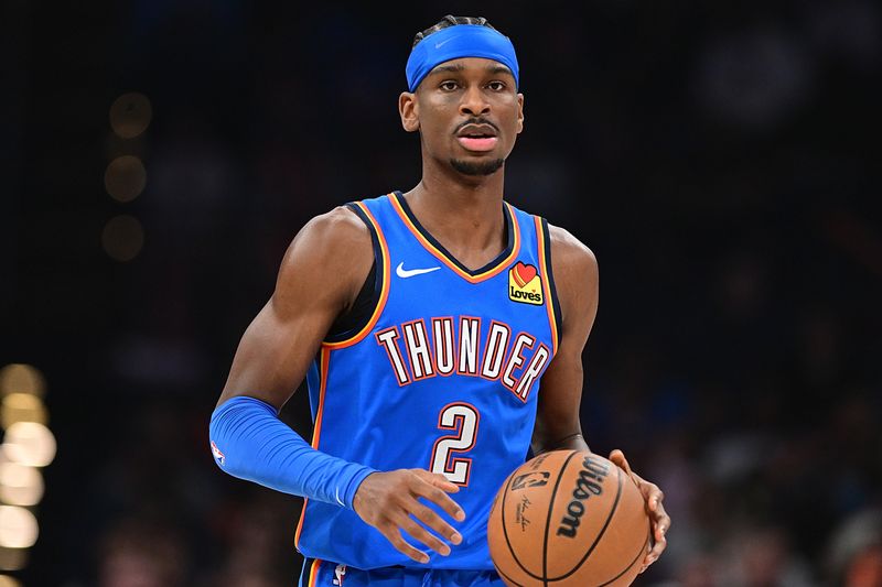 OKLAHOMA CITY, OKLAHOMA - JANUARY 31: Shai Gilgeous-Alexander #2 of the Oklahoma City Thunder handles the ball during the first half against the Denver Nuggets at Paycom Center on January 31, 2024 in Oklahoma City, Oklahoma. NOTE TO USER: User expressly acknowledges and agrees that, by downloading and or using this Photograph, user is consenting to the terms and conditions of the Getty Images License Agreement. (Photo by Joshua Gateley/Getty Images)