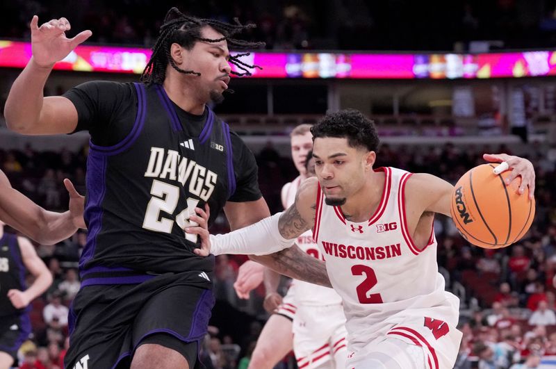 Mar 12, 2026; Chicago, IL, USA; Wisconsin Badgers guard Nick Boyd (2) drives on Washington Huskiescenter Lathan Sommerville (24) during the first half of their third round game of the Big Ten tournament at United Center. Mandatory Credit: Mark Hoffman/USA Today Network via Imagn Images
