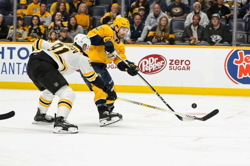 Oct 22, 2024; Nashville, Tennessee, USA;  Nashville Predators center Tommy Novak (82) takes a shot as Boston Bruins defenseman Nikita Zadorov (91) defends during the third period at Bridgestone Arena. Mandatory Credit: Steve Roberts-Imagn Images