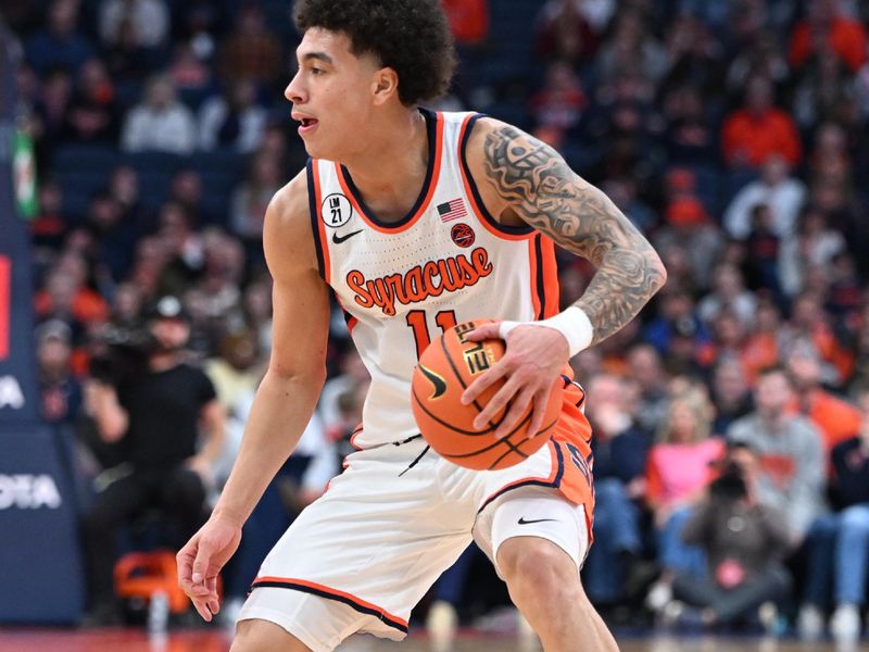 Feb 14, 2026; Syracuse, New York, USA; Syracuse Orange guard Naithan George (11) handles the ball in the second half against the Southern Methodist University Mustangs at the JMA Wireless Dome. Mandatory Credit: Mark Konezny-Imagn Images