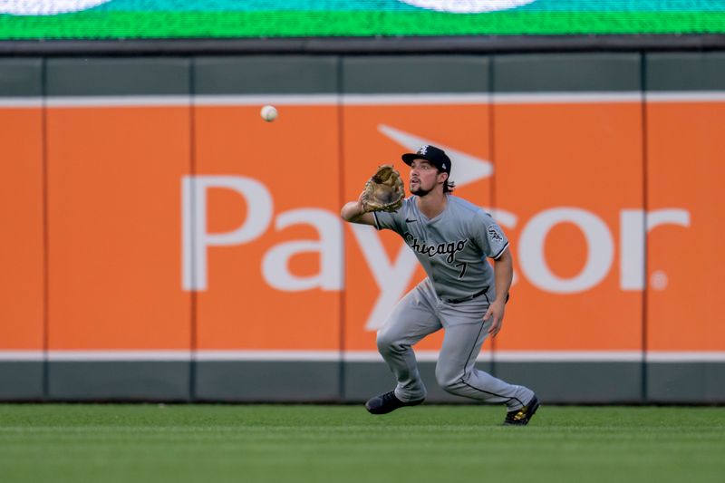 Aug 2, 2024; Minneapolis, Minnesota, USA; Chicago White Sox right fielder Dominic Fletcher (7) catches a fly ball against the Minnesota Twins in the fourth inning at Target Field. Mandatory Credit: Jesse Johnson-USA TODAY Sports