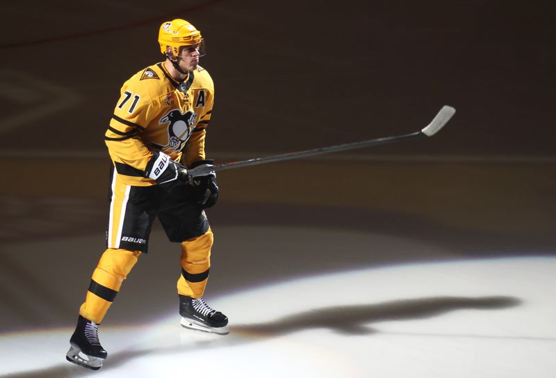 Oct 9, 2025; Pittsburgh, Pennsylvania, USA;  Pittsburgh Penguins center Evgeni Malkin (71) reacts during player introductions against the New York Islanders at PPG Paints Arena. Mandatory Credit: Charles LeClaire-Imagn Images