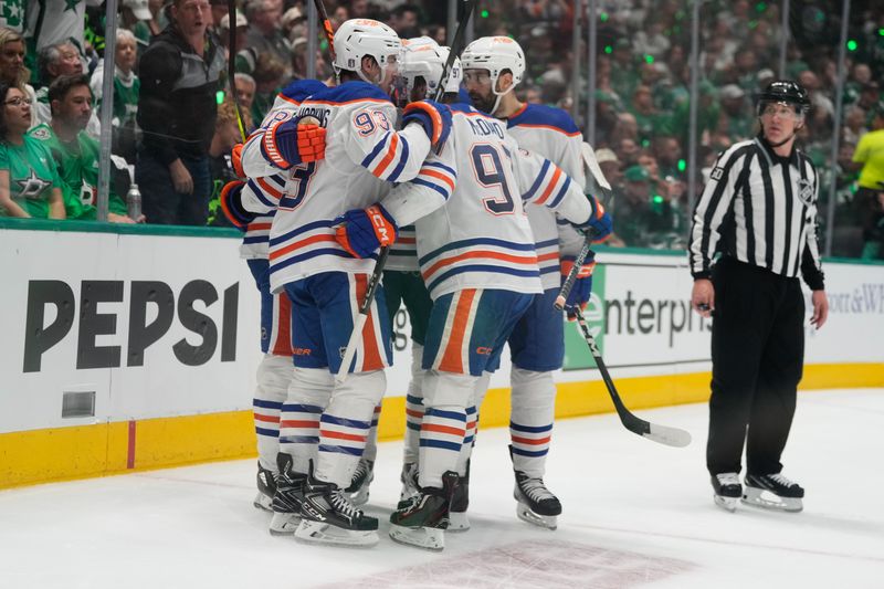 May 31, 2024; Dallas, Texas, USA; Edmonton Oilers center Ryan Nugent-Hopkins (93) celebrates with teammates after scoring a goal against the Dallas Stars during the first period between the Dallas Stars and the Edmonton Oilers in game five of the Western Conference Final of the 2024 Stanley Cup Playoffs at American Airlines Center. Mandatory Credit: Chris Jones-USA TODAY Sports