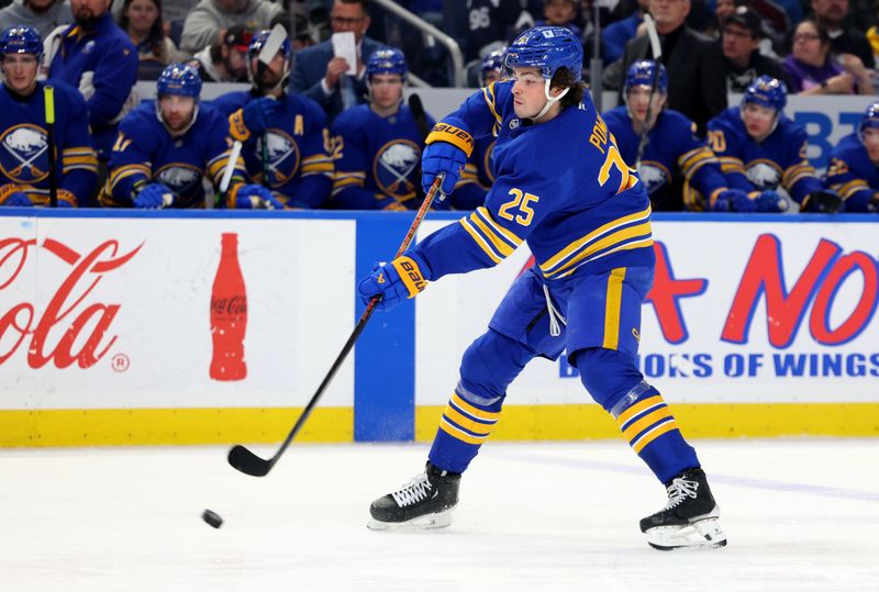 Dec 3, 2024; Buffalo, New York, USA;  Buffalo Sabres defenseman Owen Power (25) shoots the puck up ice during the second period against the Colorado Avalanche at KeyBank Center. Mandatory Credit: Timothy T. Ludwig-Imagn Images