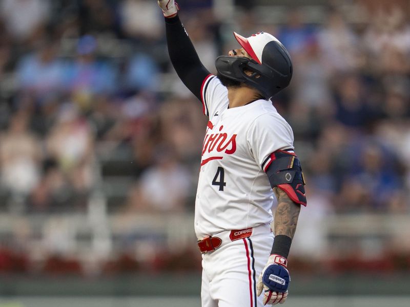 Jun 10, 2025; Minneapolis, Minnesota, USA; Minnesota Twins shortstop Carlos Correa (4) celebrates after hitting a double against the Texas Rangers in the fourth inning at Target Field. Mandatory Credit: Jesse Johnson-Imagn Images