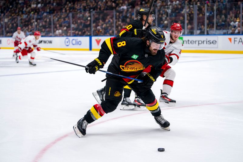 Oct 28, 2024; Vancouver, British Columbia, CAN; Vancouver Canucks forward Conor Garland (8) shoots against the Carolina Hurricanes during the third period at Rogers Arena. Mandatory Credit: Bob Frid-Imagn Images