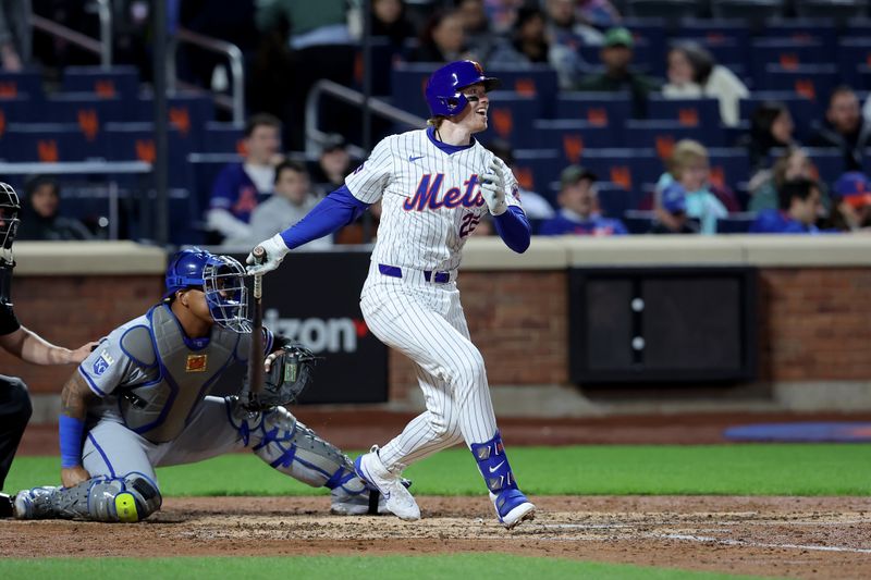 Apr 12, 2024; New York City, New York, USA; New York Mets third baseman Brett Baty (22) follows through on a two run double against the Kansas City Royals during the fifth inning at Citi Field. Mandatory Credit: Brad Penner-USA TODAY Sports