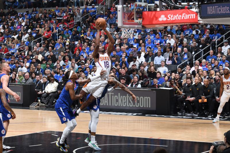 LOS ANGELES, CA - APRIL 20: Bismack Biyombo #18 of the Phoenix Suns drives to the basket during the game against the LA Clippers during Round 1 Game 3 of the 2023 NBA Playoffs on April 20, 2023 at Crypto.Com Arena in Los Angeles, California. NOTE TO USER: User expressly acknowledges and agrees that, by downloading and/or using this Photograph, user is consenting to the terms and conditions of the Getty Images License Agreement. Mandatory Copyright Notice: Copyright 2023 NBAE (Photo by Andrew D. Bernstein/NBAE via Getty Images)