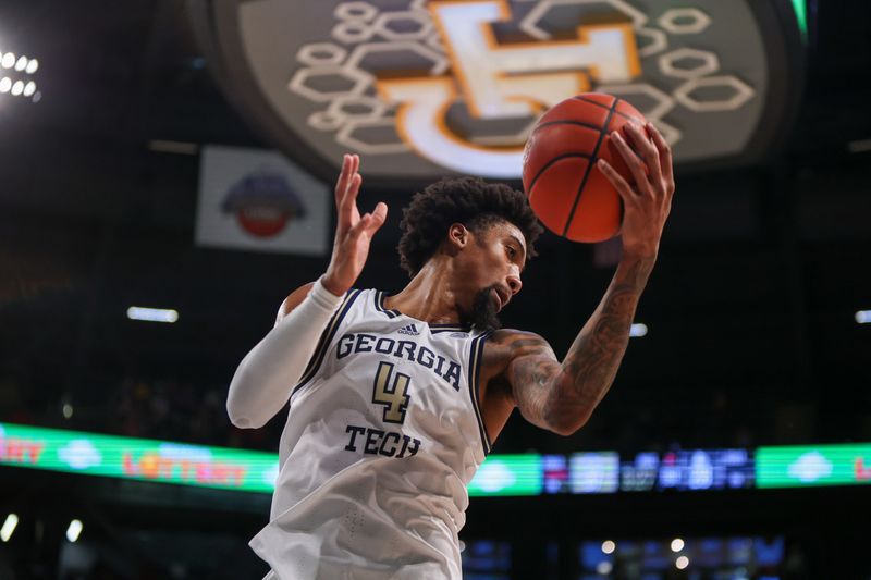 Feb 25, 2023; Atlanta, Georgia, USA; Georgia Tech Yellow Jackets forward Javon Franklin (4) grabs a rebound against the Louisville Cardinals in the first half at McCamish Pavilion. Mandatory Credit: Brett Davis-USA TODAY Sports