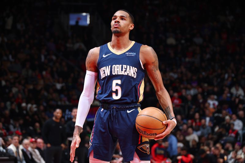 TORONTO, CANADA - JANUARY 27: Dejounte Murray #5 of the New Orleans Pelicans prepare to shoots a free throw during the game against the Toronto Raptors on January 27, 2025 at the Scotiabank Arena in Toronto, Ontario, Canada.  NOTE TO USER: User expressly acknowledges and agrees that, by downloading and or using this Photograph, user is consenting to the terms and conditions of the Getty Images License Agreement.  Mandatory Copyright Notice: Copyright 2025 NBAE (Photo by Vaughn Ridley/NBAE via Getty Images)