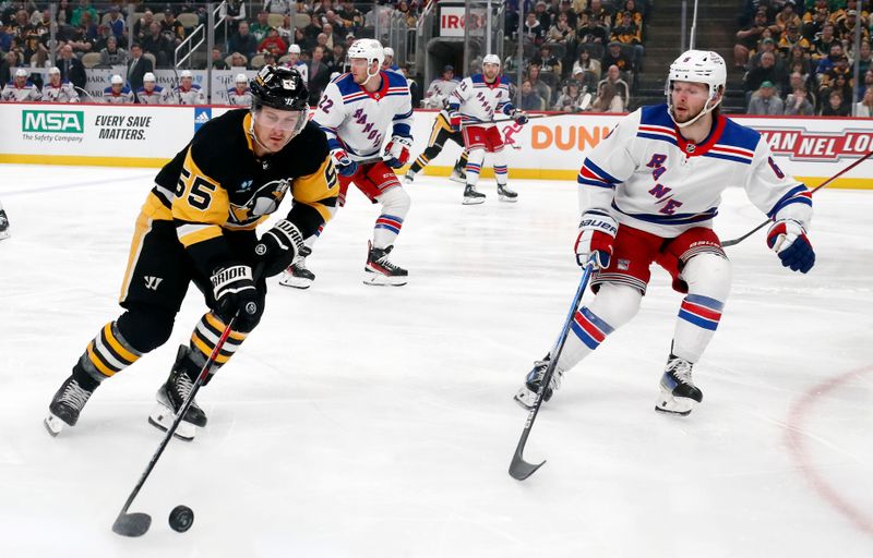 Mar 16, 2024; Pittsburgh, Pennsylvania, USA;  Pittsburgh Penguins center Noel Acciari (55) carries the puck as New York Rangers defenseman Zac Jones (6) defends  during the first period at PPG Paints Arena. Mandatory Credit: Charles LeClaire-USA TODAY Sports