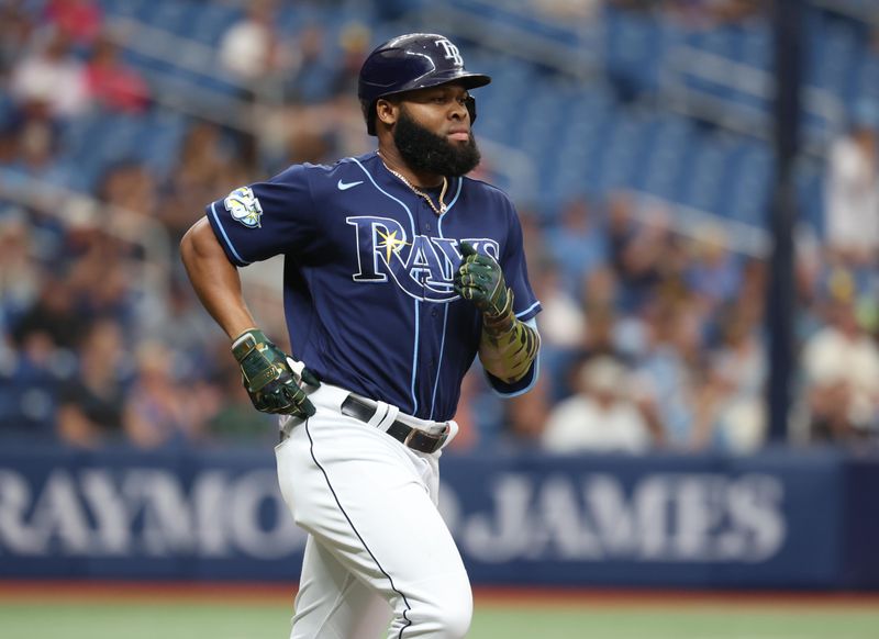 May 20, 2023; St. Petersburg, Florida, USA;  Tampa Bay Rays center fielder Manuel Margot (13) singles during the second inning against the Milwaukee Brewers at Tropicana Field. Mandatory Credit: Kim Klement-USA TODAY Sports