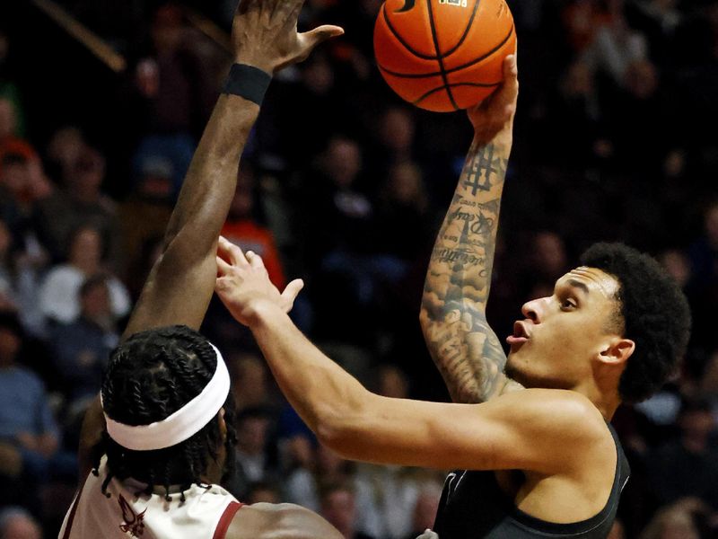 Jan 23, 2024; Blacksburg, Virginia, USA; Virginia Tech Hokies center Lynn Kidd (15) shoots the ball against Boston College Eagles guard Prince Aligbe (10) during the first half at Cassell Coliseum. Mandatory Credit: Peter Casey-USA TODAY Sports