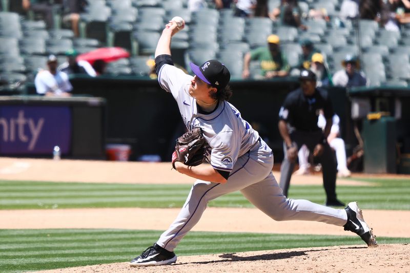 May 23, 2024; Oakland, California, USA; Colorado Rockies relief pitcher Victor Vodnik (38) pitches against the Oakland Athletics during the seventh inning at Oakland-Alameda County Coliseum. Mandatory Credit: Kelley L Cox-USA TODAY Sports