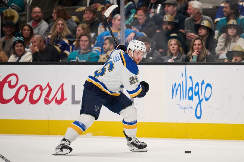 Apr 6, 2024; San Jose, California, USA; St. Louis Blues left wing Nathan Walker (26) winds up for a slapshot against the San Jose Sharks during the first period at SAP Center at San Jose. Mandatory Credit: Robert Edwards-USA TODAY Sports