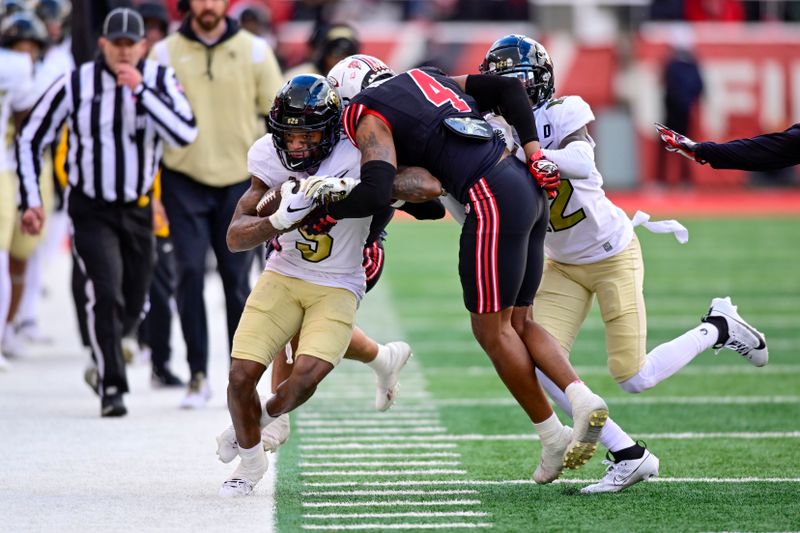 Nov 25, 2023; Salt Lake City, Utah, USA; Colorado Buffaloes wide receiver Jimmy Horn Jr. (5) is tackled out of bounds by Utah Utes cornerback JaTravis Broughton (4) at Rice-Eccles Stadium. Mandatory Credit: Christopher Creveling-USA TODAY Sports