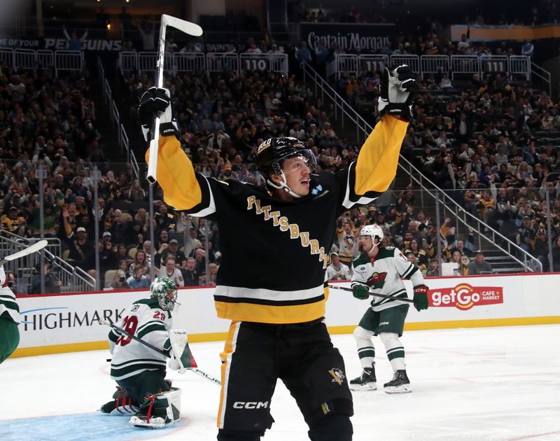 Oct 29, 2024; Pittsburgh, Pennsylvania, USA; Pittsburgh Penguins right wing Rickard Rakell (67) reacts after scoring his second goal of the game against Minnesota Wild goaltender Marc-Andre Fleury (29) during the third period at PPG Paints Arena. Mandatory Credit: Charles LeClaire-Imagn Images