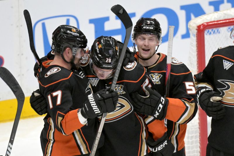 Mar 21, 2024; Anaheim, California, USA;  Anaheim Ducks left wing Alex Killorn (17) is congratulated by defenseman Gustav Lindstrom (28) and defenseman Urho Vaakanainen (5) after scoring a goal in the second period at Honda Center. Mandatory Credit: Jayne Kamin-Oncea-USA TODAY Sports