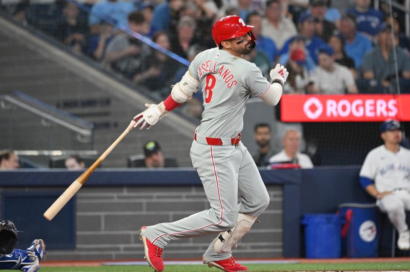 Jun 4, 2025; Toronto, Ontario, CAN;  Philadelphia Phillies right fielder Nick Castellanos (8) hits a solo home run against the Toronto Blue Jays in the second inning at Rogers Centre. Mandatory Credit: Dan Hamilton-Imagn Images