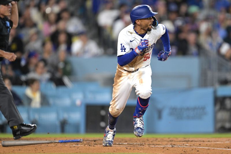 Apr 2, 2024; Los Angeles, California, USA; Los Angeles Dodgers shortstop Mookie Betts (50) runs to first after hitting a solo home run for his 1500th career hit in the third inning against the San Francisco Giants at Dodger Stadium. Mandatory Credit: Jayne Kamin-Oncea-USA TODAY Sports