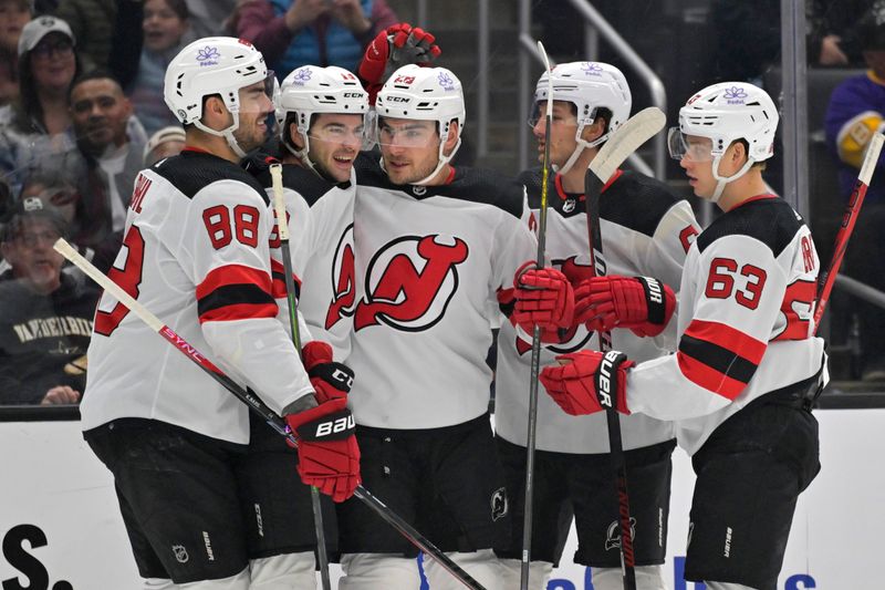 Mar 3, 2024; Los Angeles, California, USA; New Jersey Devils players celebrate after scoring a goal in the first period against the Los Angeles Kings at Crypto.com Arena. Mandatory Credit: Jayne Kamin-Oncea-USA TODAY Sports