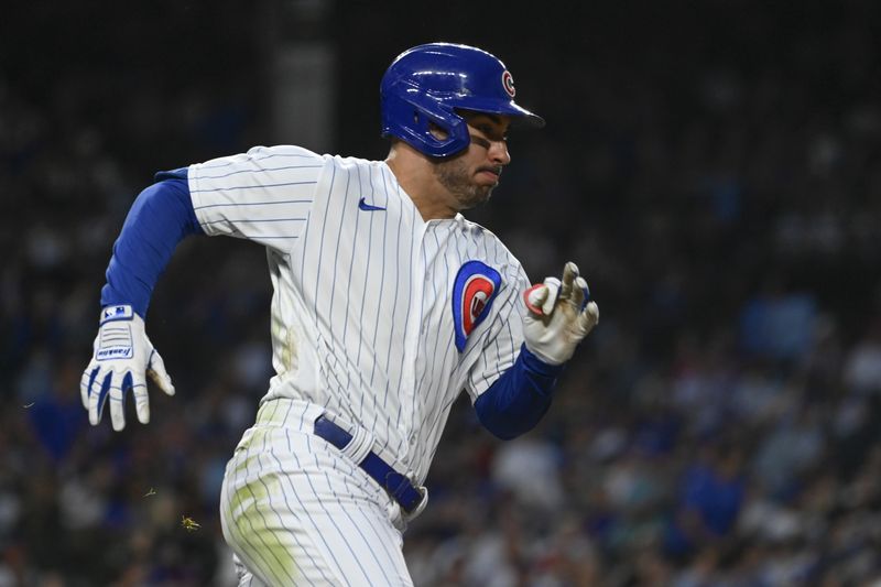 Jul 19, 2023; Chicago, Illinois, USA;  Chicago Cubs center fielder Mike Tauchman (40) runs the bases after he hits an RBI double against the Washington Nationals during the fourth inning at Wrigley Field. Mandatory Credit: Matt Marton-USA TODAY Sports