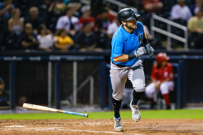 Mar 10, 2023; West Palm Beach, Florida, USA; Miami Marlins second baseman Garrett Hampson (1) hits a single during the fifth inning against the Washington Nationals at The Ballpark of the Palm Beaches. Mandatory Credit: Sam Navarro-USA TODAY Sports