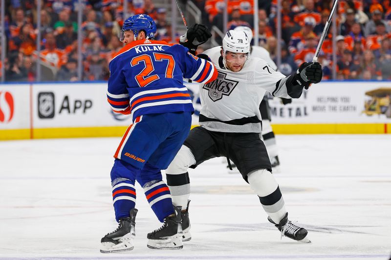 May 1, 2024; Edmonton, Alberta, CAN; Edmonton Oilers defensemen Brett Kulak (27) checks Los Angeles Kings forward Alex Laferriere (78) during the second period in game five of the first round of the 2024 Stanley Cup Playoffs at Rogers Place. Mandatory Credit: Perry Nelson-USA TODAY Sports