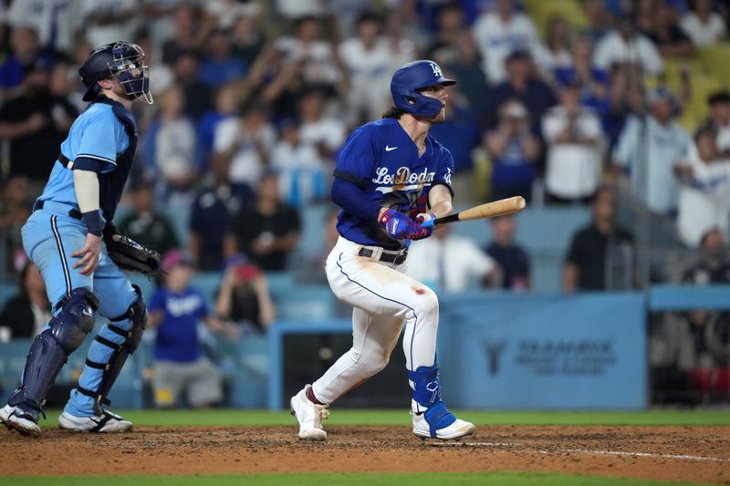 Jul 25, 2023; Los Angeles, California, USA; Los Angeles Dodgers center fielder James Outman (33) follows through on a walk-off double in the 10th inning against the Toronto Blue Jays at Dodger Stadium. Mandatory Credit: Kirby Lee-USA TODAY Sports