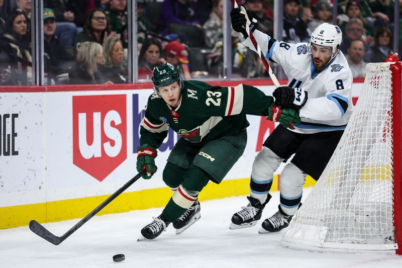 Jan 23, 2025; Saint Paul, Minnesota, USA; Minnesota Wild center Marco Rossi (23) and Utah Hockey Club center Nick Schmaltz (8) compete for the puck during the second period at Xcel Energy Center. Mandatory Credit: Matt Krohn-Imagn Images