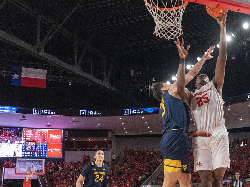 Jan 6, 2024; Houston, Texas, USA; Houston Cougars forward Joseph Tugler (25) scores against West Virginia Mountaineers guard Kerr Kriisa (3) in the second half at Fertitta Center. Mandatory Credit: Thomas Shea-USA TODAY Sports