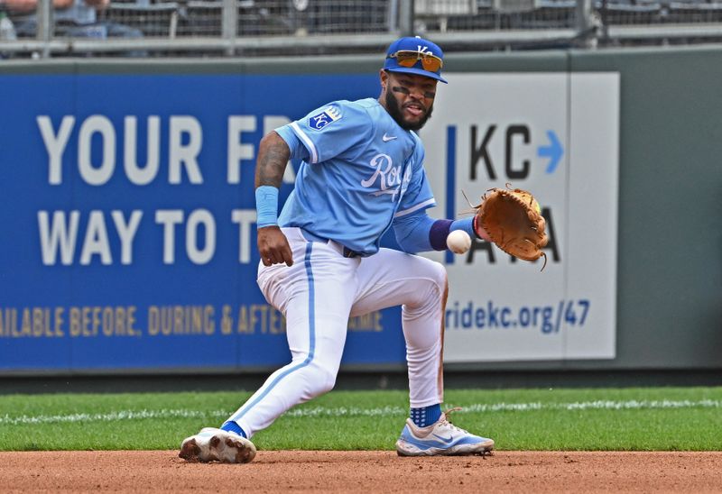 Apr 24, 2025; Kansas City, Missouri, USA;  Kansas City Royals third baseman Maikel Garcia (11) fields the ball in the seventh inning against the Colorado Rockies at Kauffman Stadium. Mandatory Credit: Peter Aiken-Imagn Images