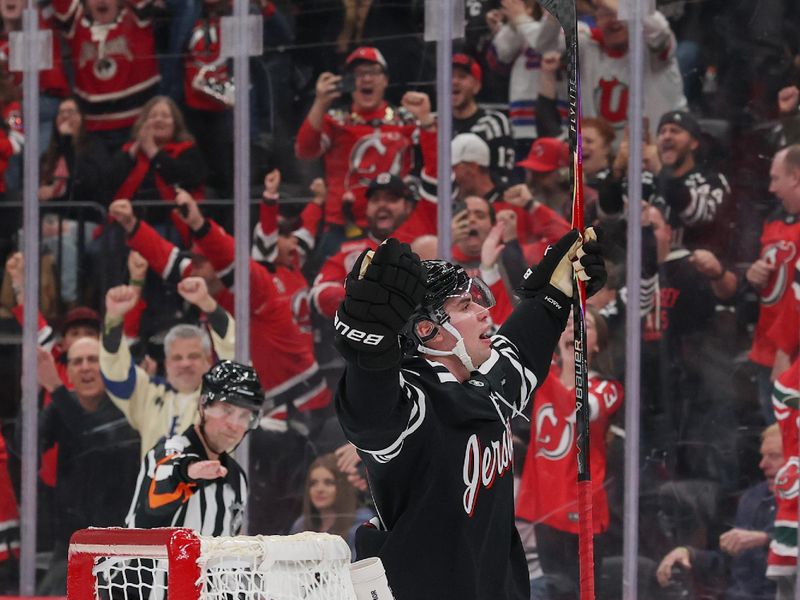 Nov 26, 2025; Newark, New Jersey, USA; New Jersey Devils defenseman Simon Nemec (17) celebrates his game winning overtime goal against the St. Louis Blues at Prudential Center. Mandatory Credit: Ed Mulholland-Imagn Images