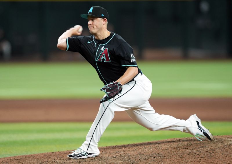 Jun 16, 2024; Phoenix, Arizona, USA; Arizona Diamondbacks pitcher Paul Sewald (38) pitches against the Chicago White Sox during the ninth inning at Chase Field. Mandatory Credit: Joe Camporeale-USA TODAY Sports