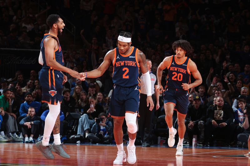 NEW YORK, NY - DECEMBER 3: Cameron Payne #1 and Miles McBride #2 of the New York Knicks high five during the game against the Orlando Magic during the Emirates NBA Cup on December 3, 2024 at Madison Square Garden in New York City, New York.  NOTE TO USER: User expressly acknowledges and agrees that, by downloading and or using this photograph, User is consenting to the terms and conditions of the Getty Images License Agreement. Mandatory Copyright Notice: Copyright 2024 NBAE  (Photo by Nathaniel S. Butler/NBAE via Getty Images)