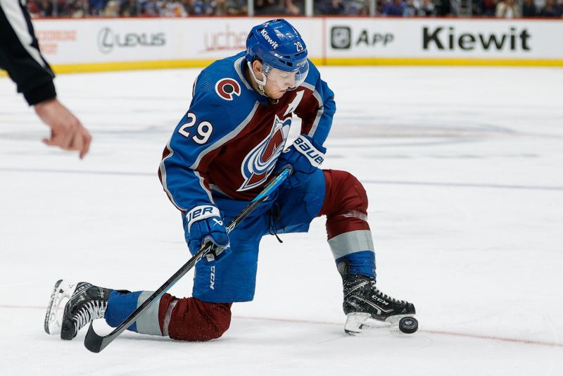 Apr 26, 2024; Denver, Colorado, USA; Colorado Avalanche center Nathan MacKinnon (29) controls the puck in the second period against the Winnipeg Jets in game three of the first round of the 2024 Stanley Cup Playoffs at Ball Arena. Mandatory Credit: Isaiah J. Downing-USA TODAY Sports