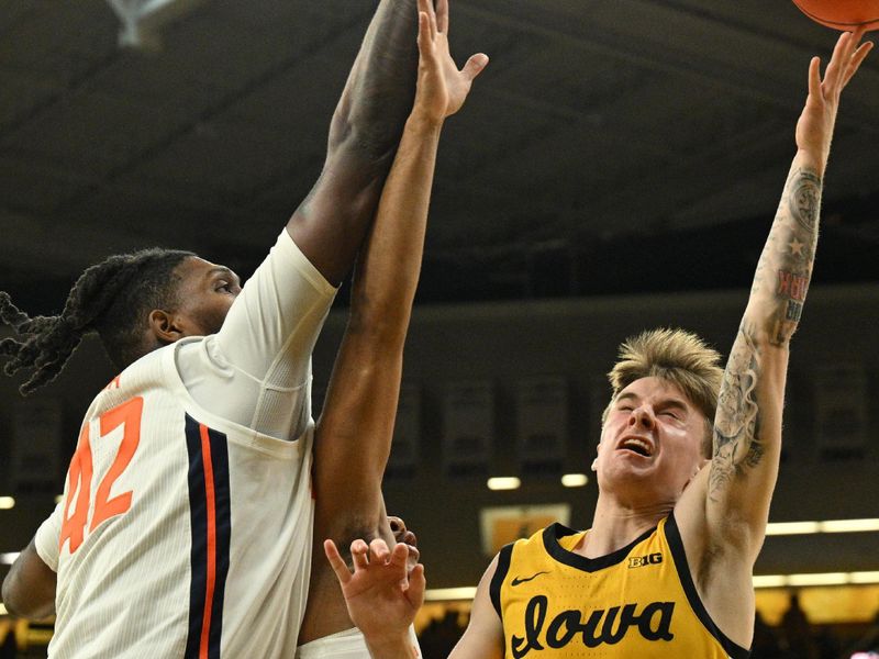 Mar 10, 2024; Iowa City, Iowa, USA; Illinois Fighting Illini forward Dain Dainja (42) and guard Justin Harmon (4) defend the shot of Iowa Hawkeyes guard Brock Harding (2) during the second half at Carver-Hawkeye Arena. Mandatory Credit: Jeffrey Becker-USA TODAY Sports