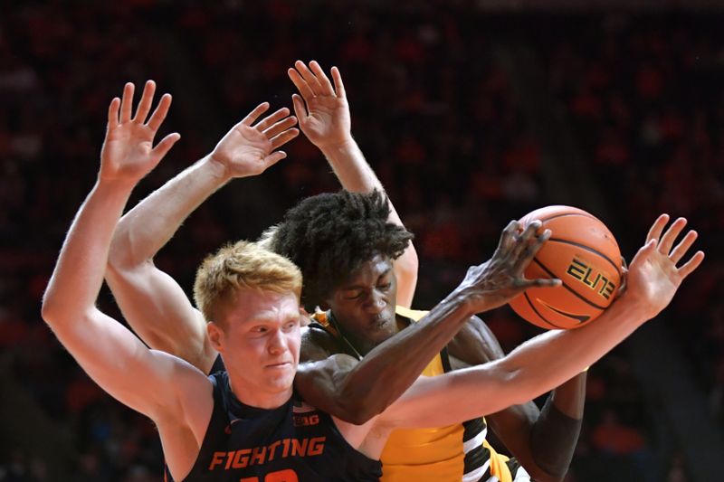 Nov 17, 2023; Champaign, Illinois, USA; Illinois Fighting Illini guard Luke Goode (10) and Valparaiso Beacons guard Jaxon Edwards (0) wrestle for a rebound during the second half at State Farm Center. Mandatory Credit: Ron Johnson-USA TODAY Sports