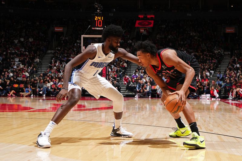 TORONTO, CANADA - JANUARY 3: Jonathan Isaac #1 of the Orlando Magic plays defense during the game against the Toronto Raptors on January 3, 2025 at the Scotiabank Arena in Toronto, Ontario, Canada.  NOTE TO USER: User expressly acknowledges and agrees that, by downloading and or using this Photograph, user is consenting to the terms and conditions of the Getty Images License Agreement.  Mandatory Copyright Notice: Copyright 2025 NBAE(Photo by Mark Blinch/NBAE via Getty Images)