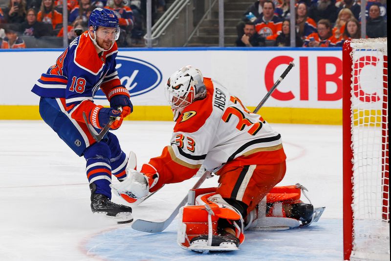 Jan 26, 2026; Edmonton, Alberta, CAN; Anaheim Ducks goaltender Ville Husso (33) makes a save on Edmonton Oilers forward Zach Hyman (18) during the third period at Rogers Place. Mandatory Credit: Perry Nelson-Imagn Images