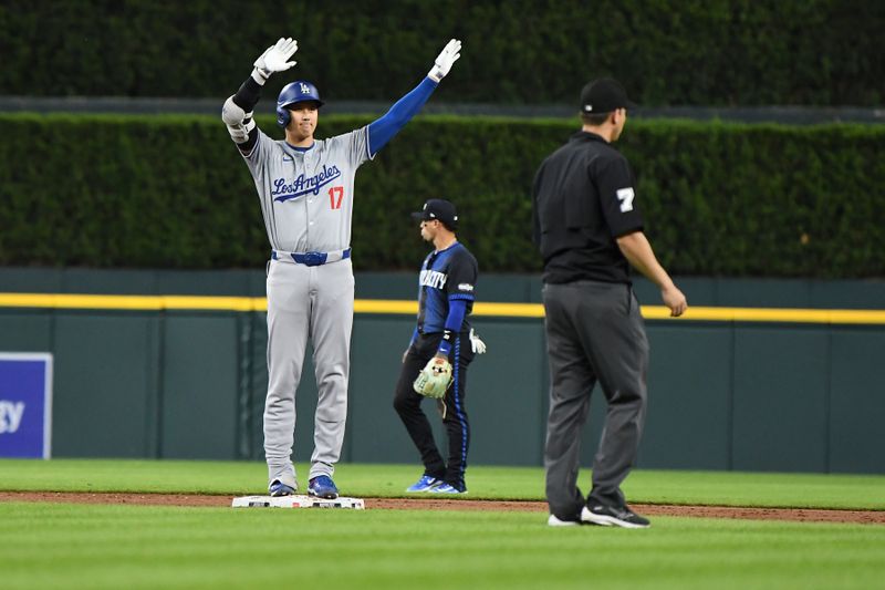 Jul 12, 2024; Detroit, Michigan, USA;  Los Angeles Dodgers designated hitter Shohei Ohtani (17) celebrates at second base after hitting an RBI double in the ninth inning against the Detroit Tigers at Comerica Park. Mandatory Credit: Lon Horwedel-USA TODAY Sports