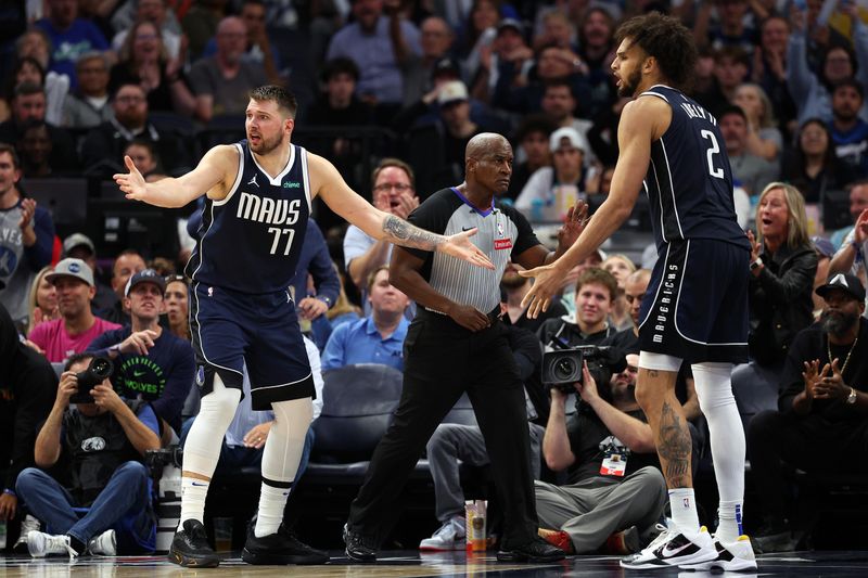 MINNEAPOLIS, MINNESOTA - OCTOBER 29: Luka Doncic #77 and Dereck Lively II #2 of the Dallas Mavericks react against the Minnesota Timberwolves in the third quarter at Target Center on October 29, 2024 in Minneapolis, Minnesota. The Mavericks defeated the Timberwolves 120-114. NOTE TO USER: User expressly acknowledges and agrees that, by downloading and or using this photograph, User is consenting to the terms and conditions of the Getty Images License Agreement. (Photo by David Berding/Getty Images)