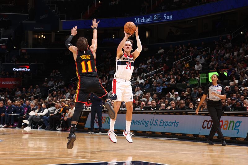 WASHINGTON, DC -? OCTOBER 30: Corey Kispert #24 of the Washington Wizards shoots a three point basket during the game against the Atlanta Hawks during a regular season game on October 30, 2024 at Capital One Arena in Washington, DC. NOTE TO USER: User expressly acknowledges and agrees that, by downloading and or using this Photograph, user is consenting to the terms and conditions of the Getty Images License Agreement. Mandatory Copyright Notice: Copyright 2024 NBAE (Photo by Kenny Giarla/NBAE via Getty Images)