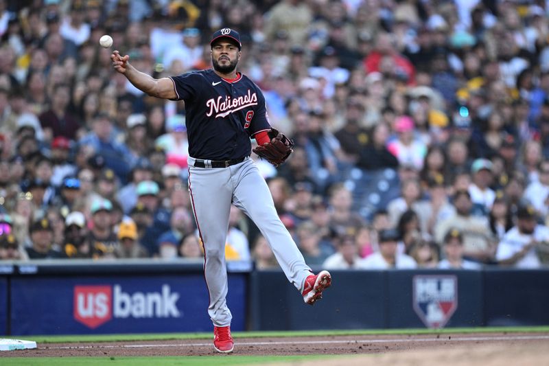 Jun 23, 2023; San Diego, California, USA; Washington Nationals third baseman Jeimer Candelario (9) throws to first base on a ground out by San Diego Padres right fielder Fernando Tatis Jr. (not pictured) to end the third inning at Petco Park. Mandatory Credit: Orlando Ramirez-USA TODAY Sports