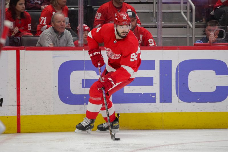 Mar 18, 2023; Detroit, Michigan, USA; Detroit Red Wings defenseman Jake Walman (96) handles the puck during the first period at Little Caesars Arena. Mandatory Credit: Brian Bradshaw Sevald-USA TODAY Sports